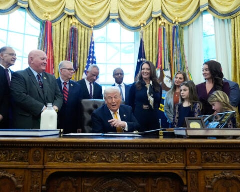 Milk gets a perch on Trump's desk but takes a back seat at bill signing
