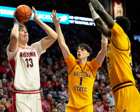 Peat scores 24, No. 1 Arizona remains undefeated with 89-82 win over rival Arizona State