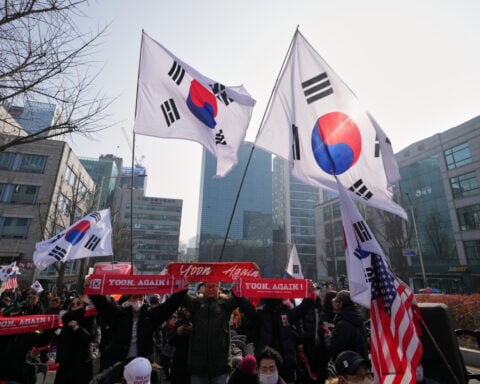 A South Korean court sentences Yoon to 5 years in prison on charges related to martial law decree