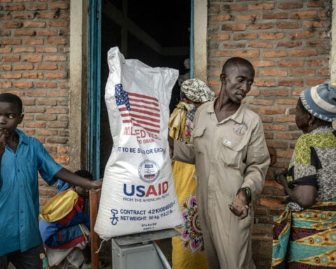 International aid groups are dealing with the pain of slashed USAID funding by cutting staff, localizing and coordinating better