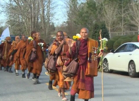 Hundreds gather in the Charlotte area to meet the monks 'walking for peace' across the country
