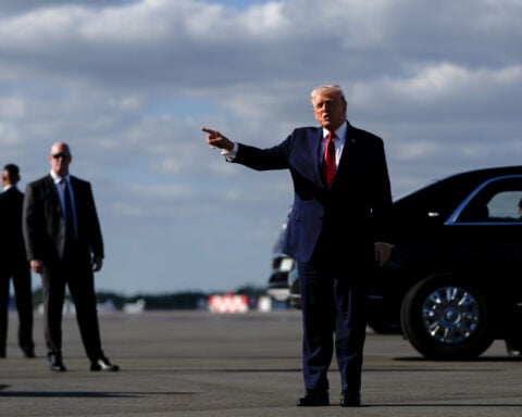 Trump issues a flurry of pardons, including for a woman whose sentence he commuted in his first term