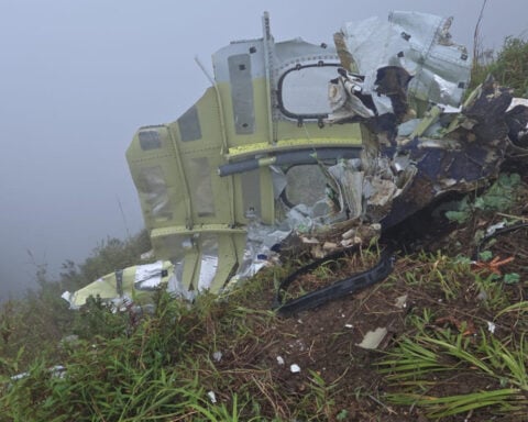 Indonesian rescuers find a body near wreckage of a plane that crashed with 11 aboard