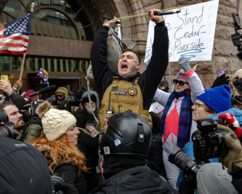 Far-right activist chased away by counterdemonstrators while leading small rally in Minneapolis