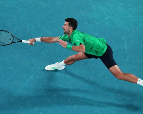 Djokovic equals two all-time records and wins his 100th match at Australian Open