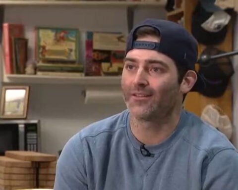 Sign maker carving out fans with custom handmade work