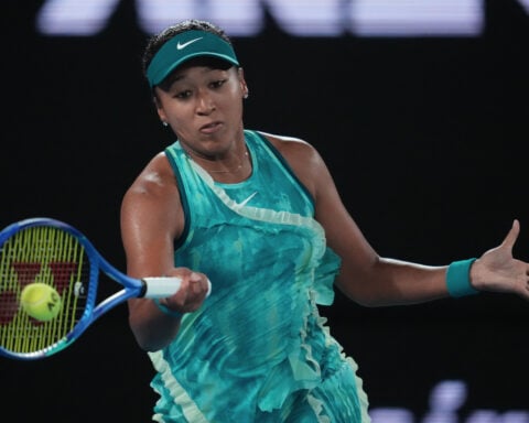 Naomi Osaka makes grand entrance and big fashion statement at Australian Open