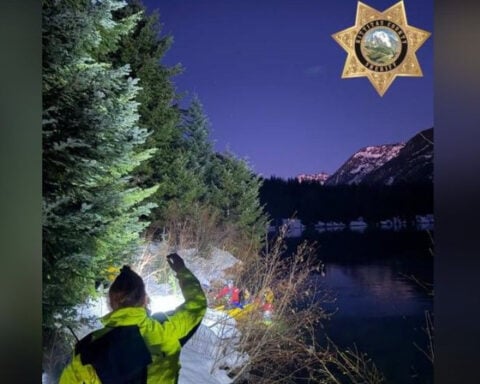 Woman and dog saved from freezing water by rescuers