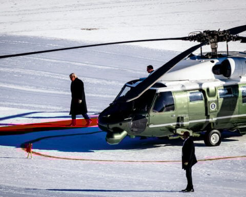 The Latest: Trump says a Greenland deal 'framework' is reached and cancels tariff threat