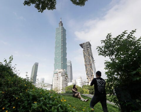 Alex Honnold is climbing Taipei 101 with no ropes, live on TV. It's drawing excitement — and concern