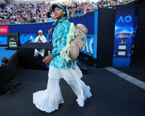 Naomi Osaka tones down her walk-on outfit. Turns up the heat at Australian Open