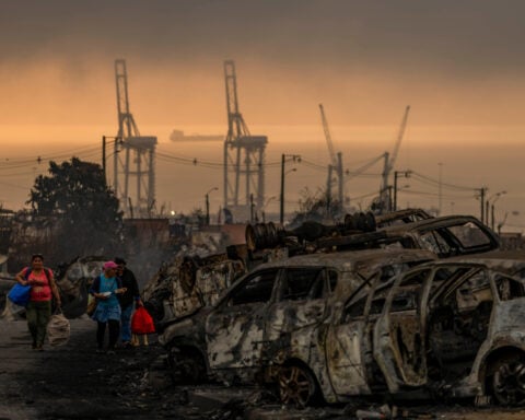 Firefighters face attacks, drones and arsonists while battling deadly blazes in Chile