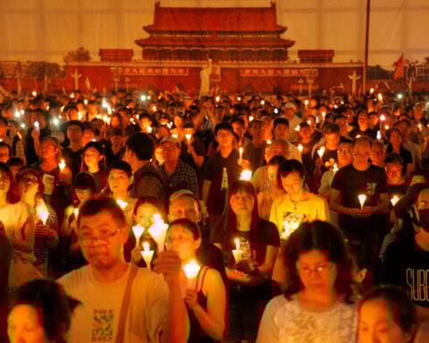 Hong Kong vigil organizer says she was seeking democracy, not end to Communist Party rule