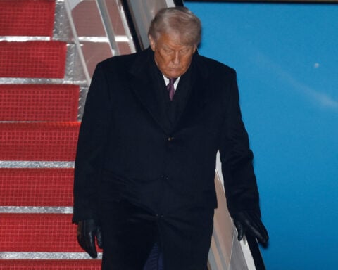 The Latest: Global leaders say world economy shows resilience