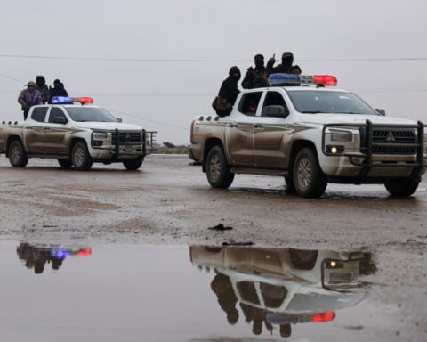 Syrian forces take control of prison housing IS members after Kurdish fighters evacuate