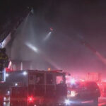 Neighbors spring into action as firefighters battle two-alarm blaze in Northeast Baltimore amid freezing temps