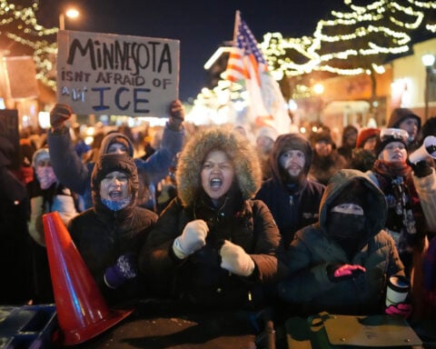 From frigid quiet to outraged sorrow, a few hours on Minneapolis street where agents killed man