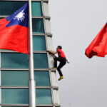 American rock climber Alex Honnold reaches top of Taipei 101 skyscraper without ropes