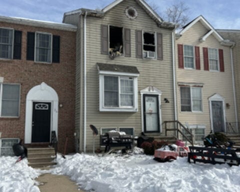 Mother drops baby from window in fire