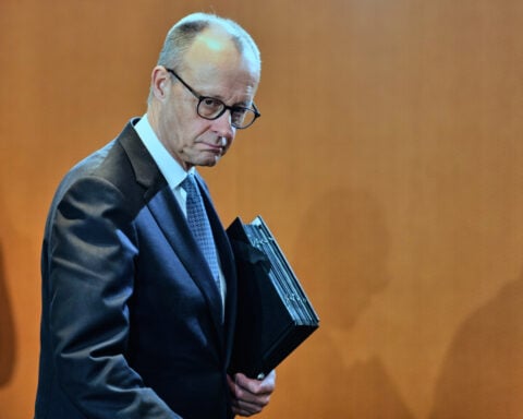 Germany trims this year's growth forecast to 1% as its economy is slow to gather pace