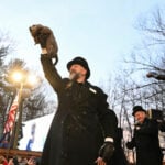 Punxsutawney Phil prepares to issue his Groundhog Day weather verdict from Gobbler's Knob