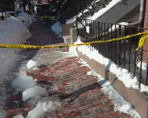 Sidewalk blocked off after ice chunks fall from buildings