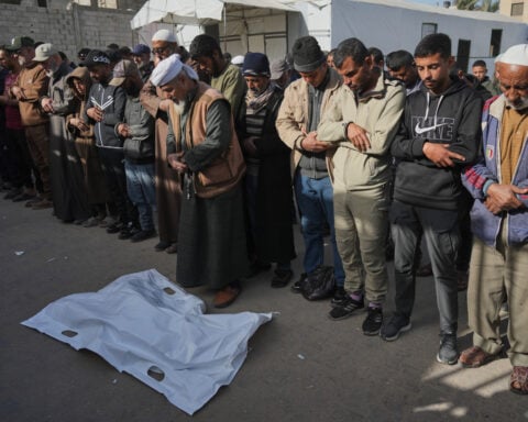 Gaza's border crossing to Egypt reopens in a key step for truce but only few Palestinians can cross