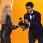 A smiling Cher laughs at her Grammys flubs in a good-natured, chaotic appearance