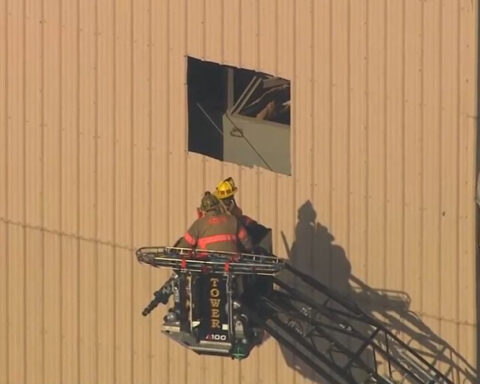 Crews free worker trapped in elevated sand hopper
