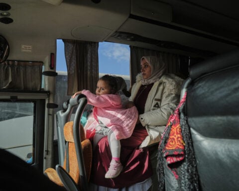 Palestinians wait at border between Gaza and Egypt as uncertainty clouds reopening of Rafah crossing