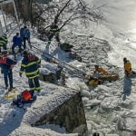 Firefighters rescue swan stuck in frozen Connecticut river