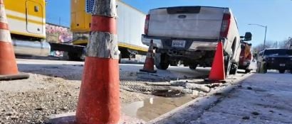 Mystery manhole leak creating an icy hazard for food wholesaler