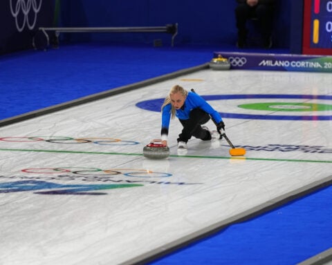 Curling opens competition at 2026 Winter Olympics as brief power outage pauses play, luge training