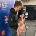 A pink backpack and an odd phone case are US Speedskating's fantasy football punishments
