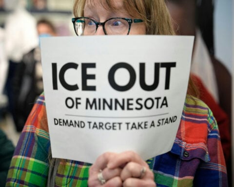 Why corporate America is mostly staying quiet as federal immigration agents show up at its doors