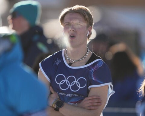 Olympic slopestyler shows some skin, skis down the mountain in a tank top