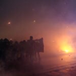 Italian police fire tear gas as protesters clash near Winter Olympics hockey venue