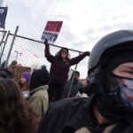 Police arrest protesters at Minneapolis federal building on 1-month anniversary of woman's death