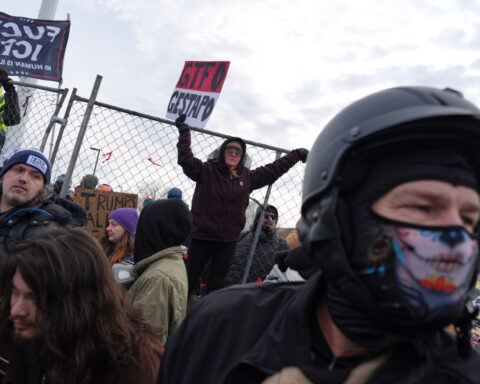 Police arrest protesters at Minneapolis federal building on 1-month anniversary of woman's death