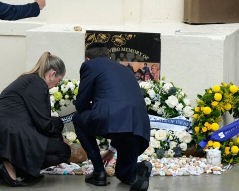Israel's president visits Sydney's Bondi Beach massacre site and meets victims' families