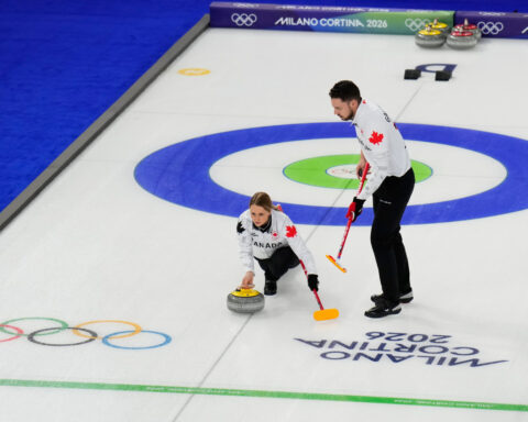 On the ice, these curlers are scowling at each other. Off the ice, they're happily married