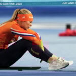 Jake Paul sits in the second row to watch his fiancée, Jutta Leerdam, in Olympic speedskating