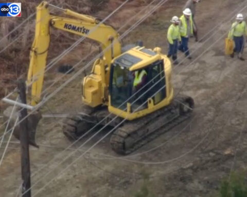 Operator rescued after backhoe gets tangled up in power line near Houston, video shows
