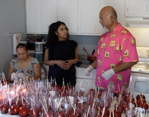 Candy apple vendor rebuilds life one sweet treat at a time after losing home in fire