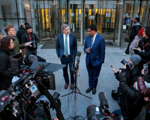 Justice Department un-redacts more names in Epstein files after pressure from lawmakers