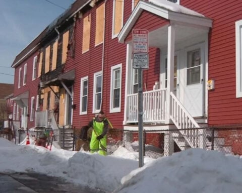 Good Samaritan shovels busy sidewalk after fire left building abandoned