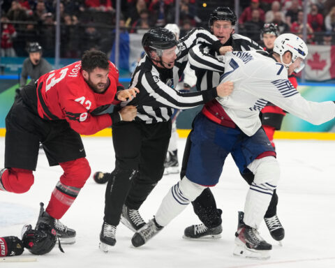 Tom Wilson fights in Canada's game vs. France at the Olympics