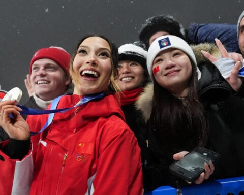 Eileen Gu wins silver for 5th Olympic medal. Canadian Megan Oldham's gold is her 2nd of the Games