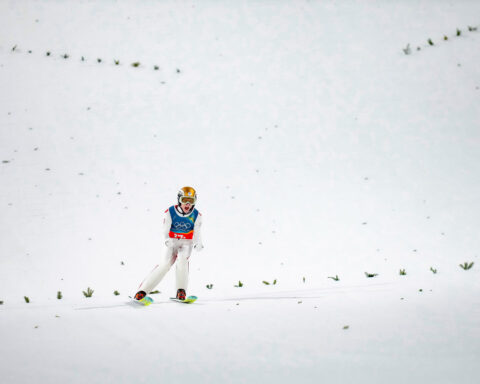 Austria wins gold in 1st Olympic men's super team ski jump as event is shortened due to weather
