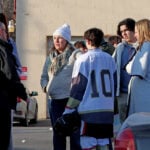 Police credit a good Samaritan for ending a deadly shooting at a Rhode Island ice rink